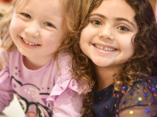 two female kids smiling
